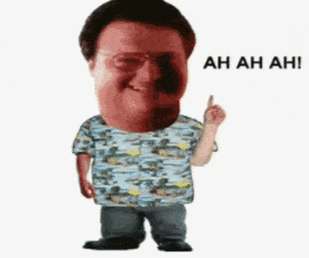 Man humourously wagging his finger in denial.